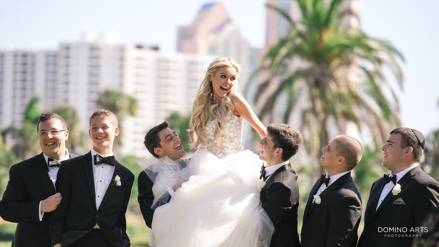 Fun groomsmen with bride picture