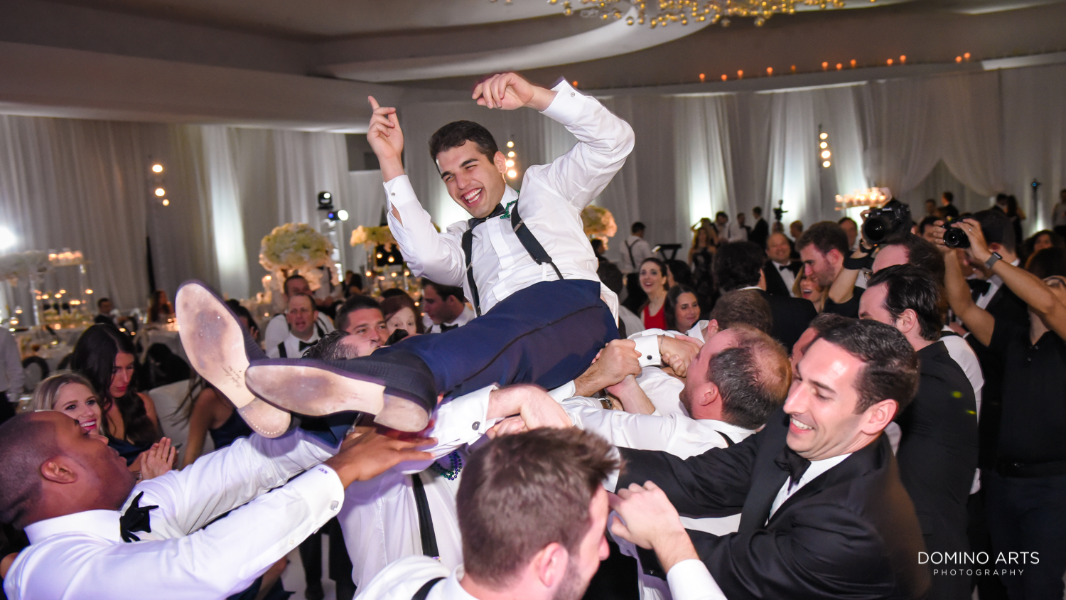 Fun crazy party pictures at fontainebleau miami wedding groom crowd surfing