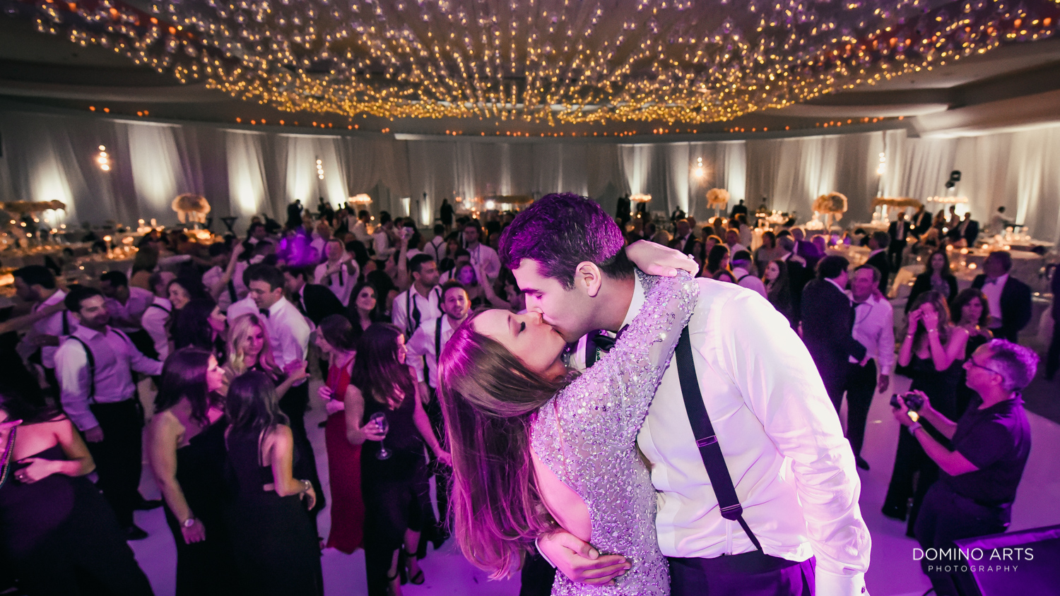 Romantic kiss at fun party pictures at fontainebleau miami wedding