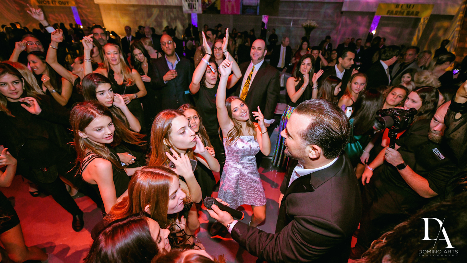 fun horah at Luxurious Broadway Theme Bat Mitzvah at New World Symphony in Miami Beach by Domino Arts Photography
