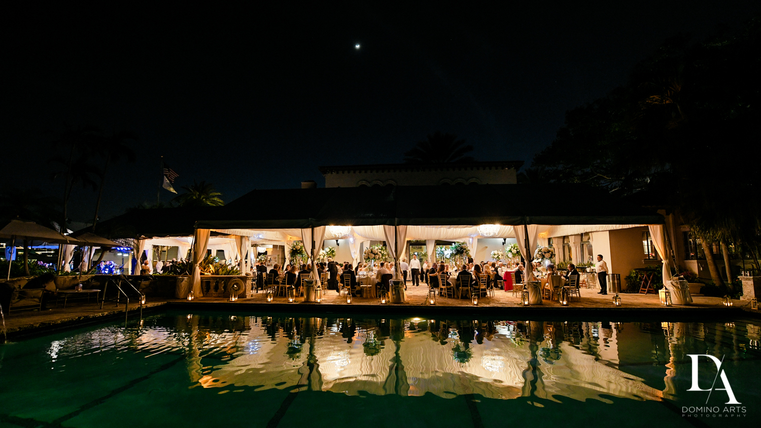 poolside reception at Tropical Garden Wedding at Fisher Island Miami by Domino Arts Photography