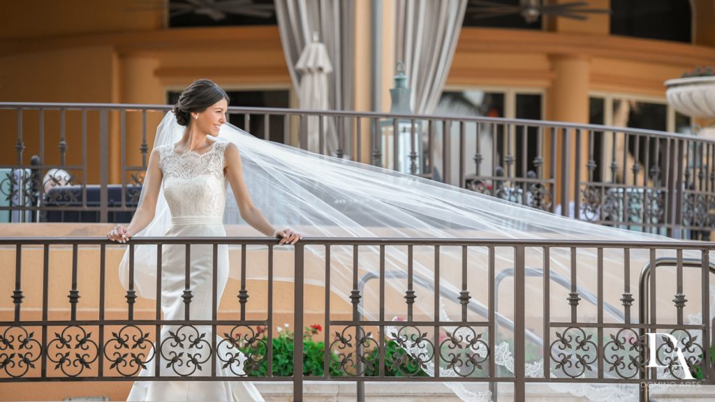 bride and veil at Romantic Ocean Side Wedding at Eau Palm Beach by Domino Arts Photography