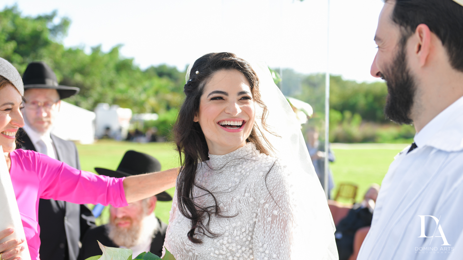 happy bride at Traditional Jewish Wedding at Deering Estate Miami by Domino Arts Photography